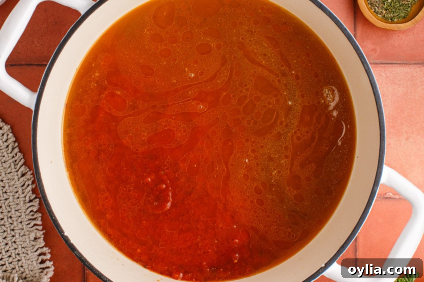 marinara sauce added to ground beef and sausage mixture