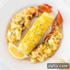 Lobster Thermidor on a plate with corn on the cob