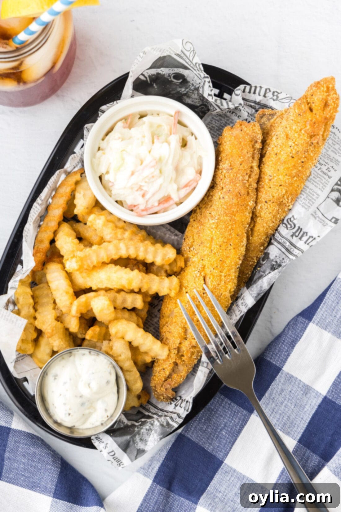 Golden Fried Whiting 12 A basket full of golden fried whiting fish fillets, served with french fries and coleslaw