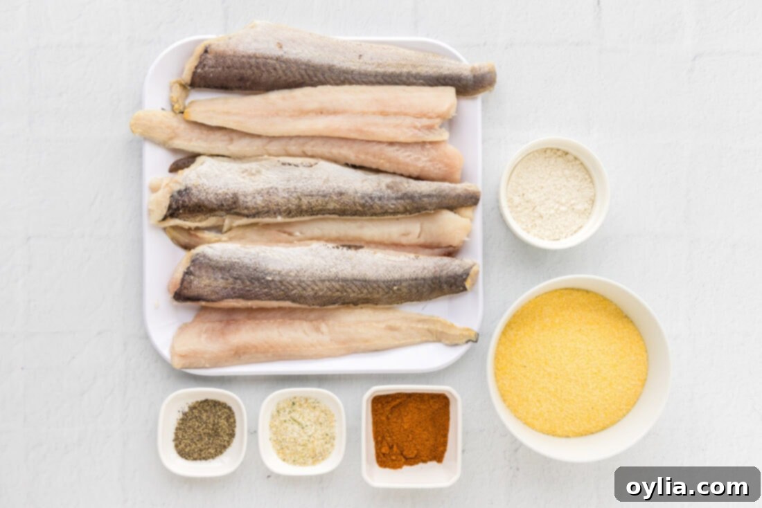Golden Fried Whiting 4 A selection of ingredients for fried whiting fish, including fish fillets, cornmeal, and seasonings