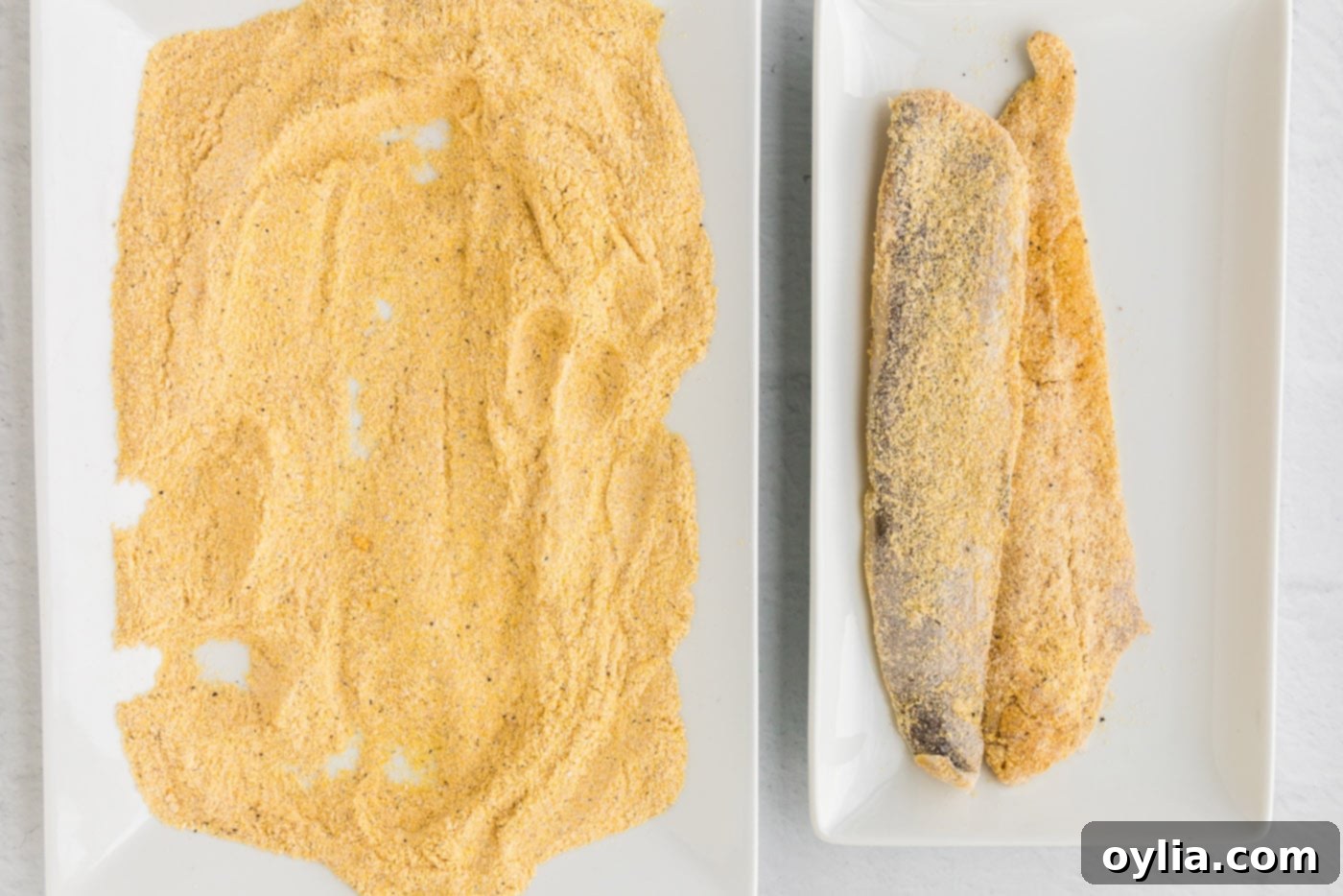 Golden Fried Whiting 8 Several whiting fish fillets coated in cornmeal, ready for frying