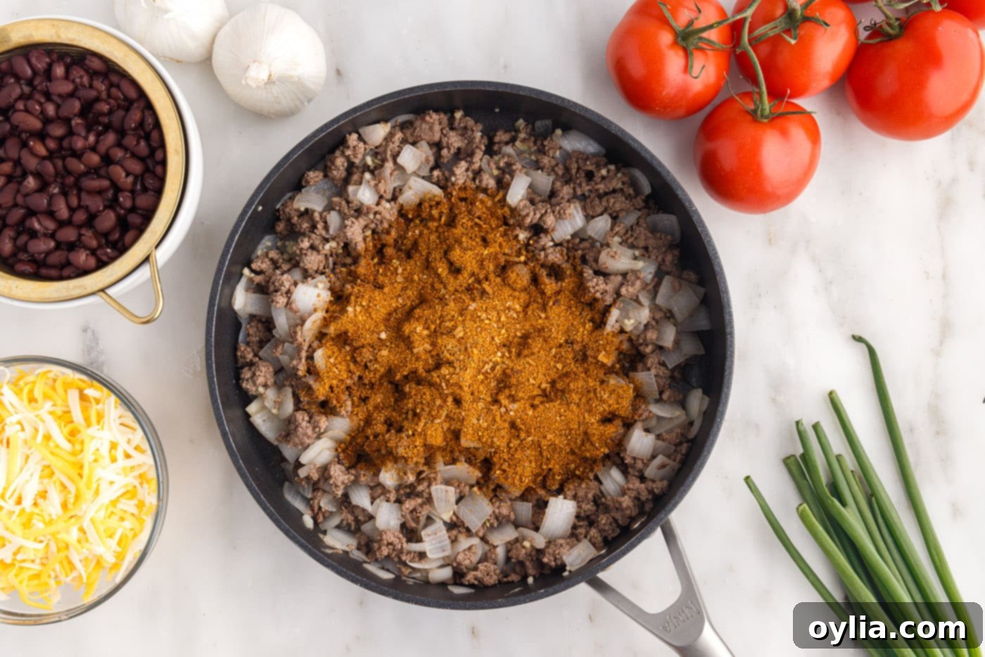 taco seasoning over ground beef and onion mixture