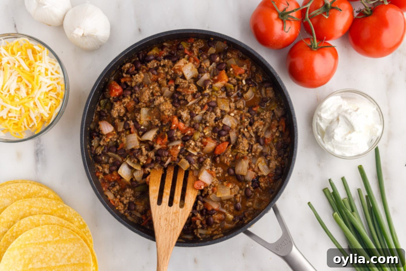 Mexican lasagna ground beef mixture in a skillet
