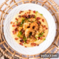 Southern Shrimp and Grits 15 Overhead photo of a plate of Cheesy Cajun Shrimp and Grits, ready to be enjoyed.
