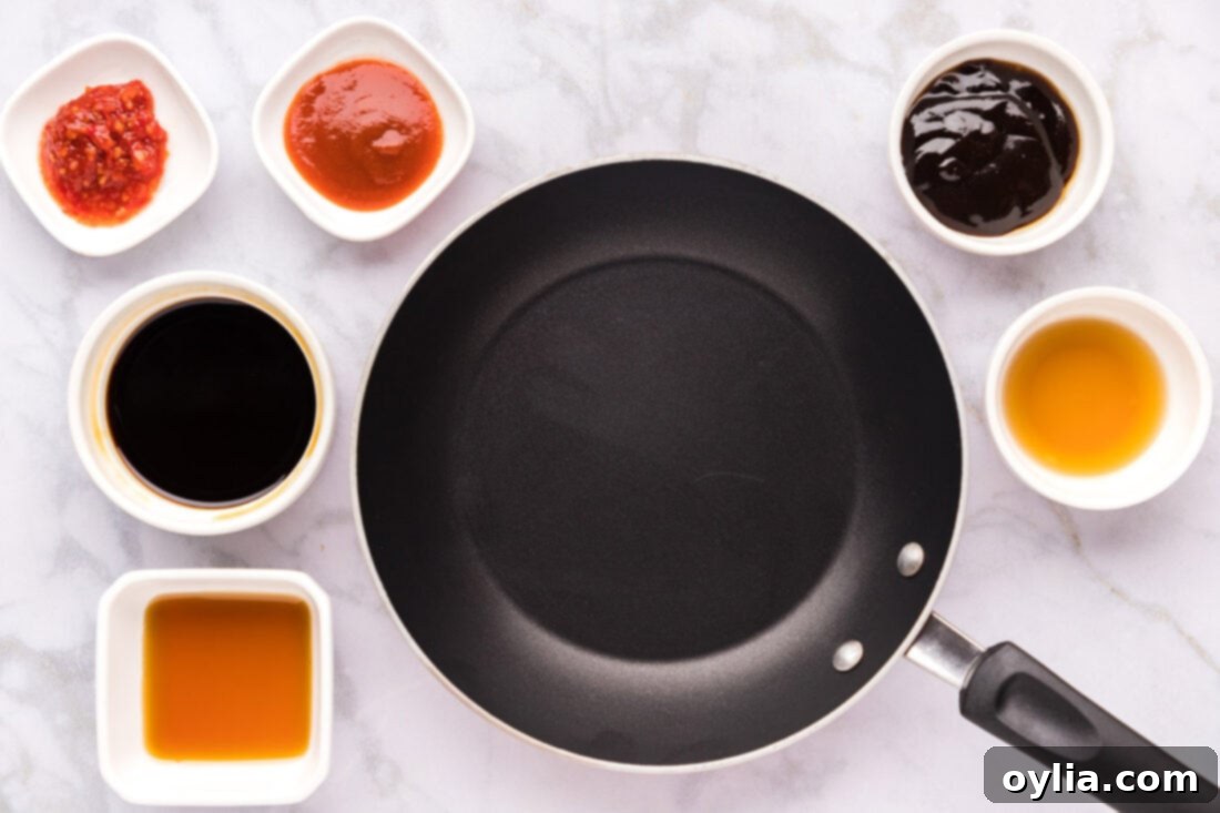 Ingredients for Salmon Sauce including soy sauce, hoisin, sriracha, chili sauce, maple syrup, sesame oil, cornstarch, and water.