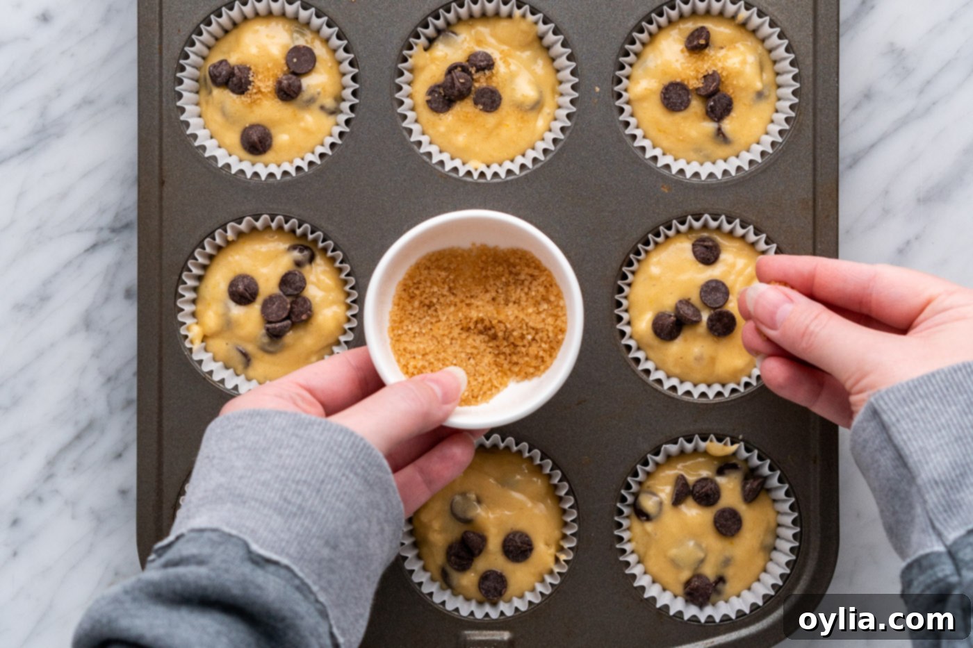 Sprinkling sugar in the raw on top of muffin batter for a sweet, crunchy topping.