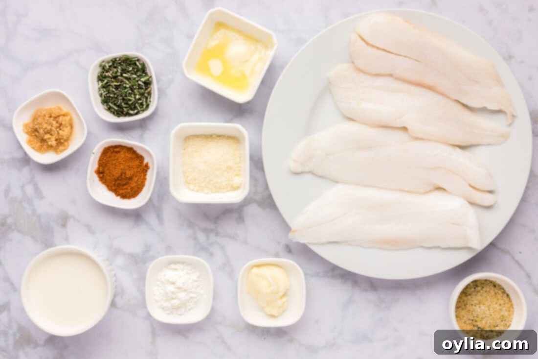 Ingredients for Pan-Seared Orange Roughy laid out: orange roughy fillets, butter, garlic salt, and Old Bay seasoning