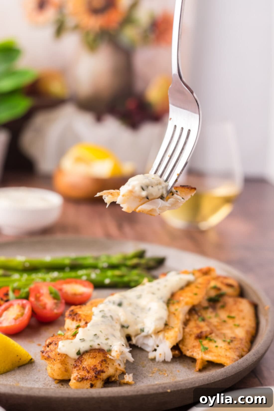 Piece of Orange Roughy on a fork, ready to be eaten