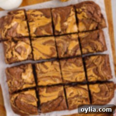 Peanut Butter Brownies cut up into squares on a wooden platter