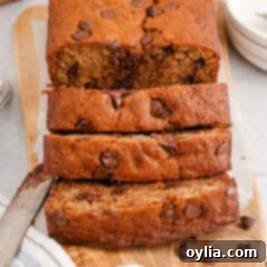 Close up of a loaf of Chocolate Chip Banana Bread cut in slices