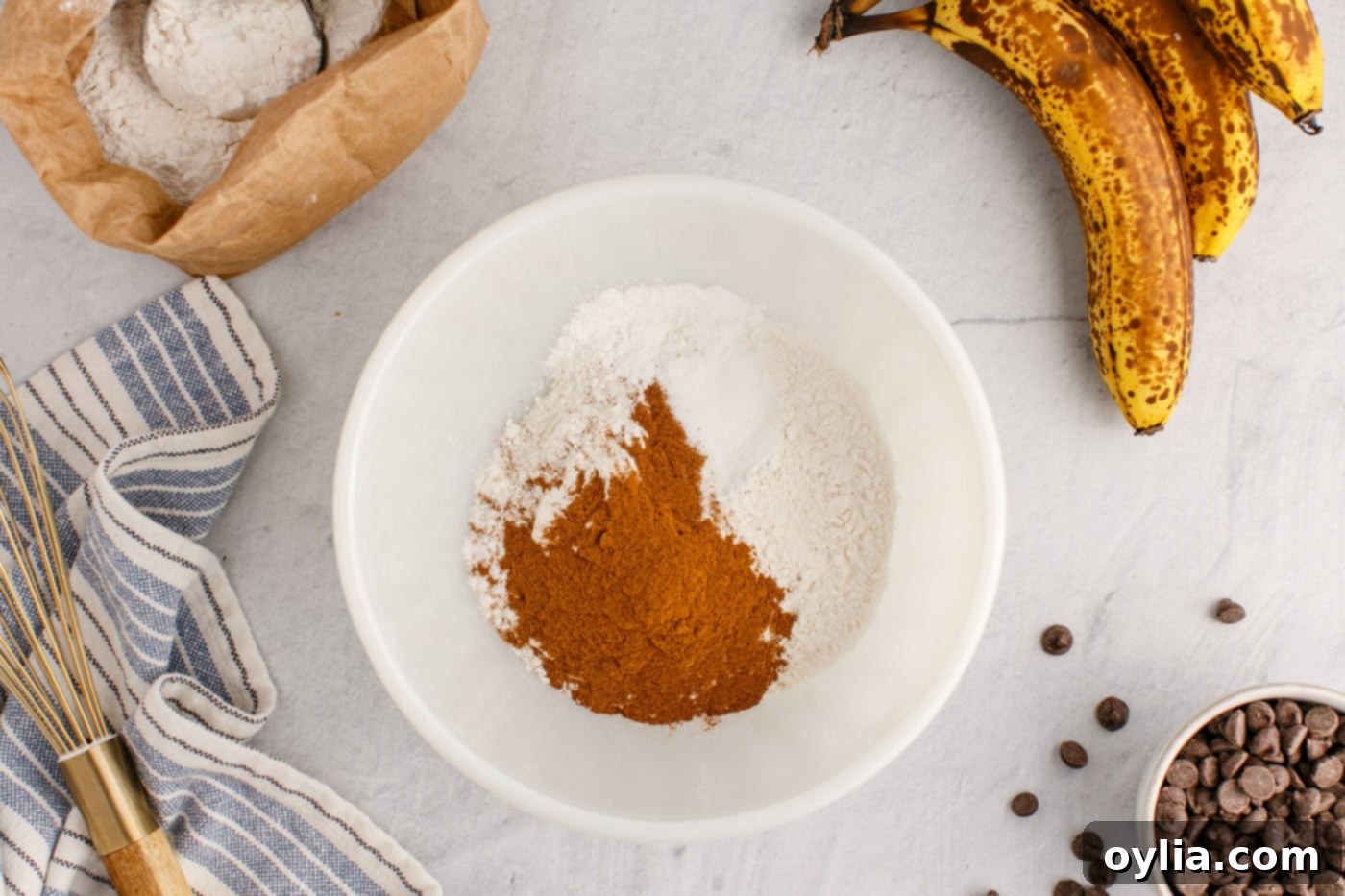 cinnamon, flour, baking soda, baking powder, and salt in a bowl
