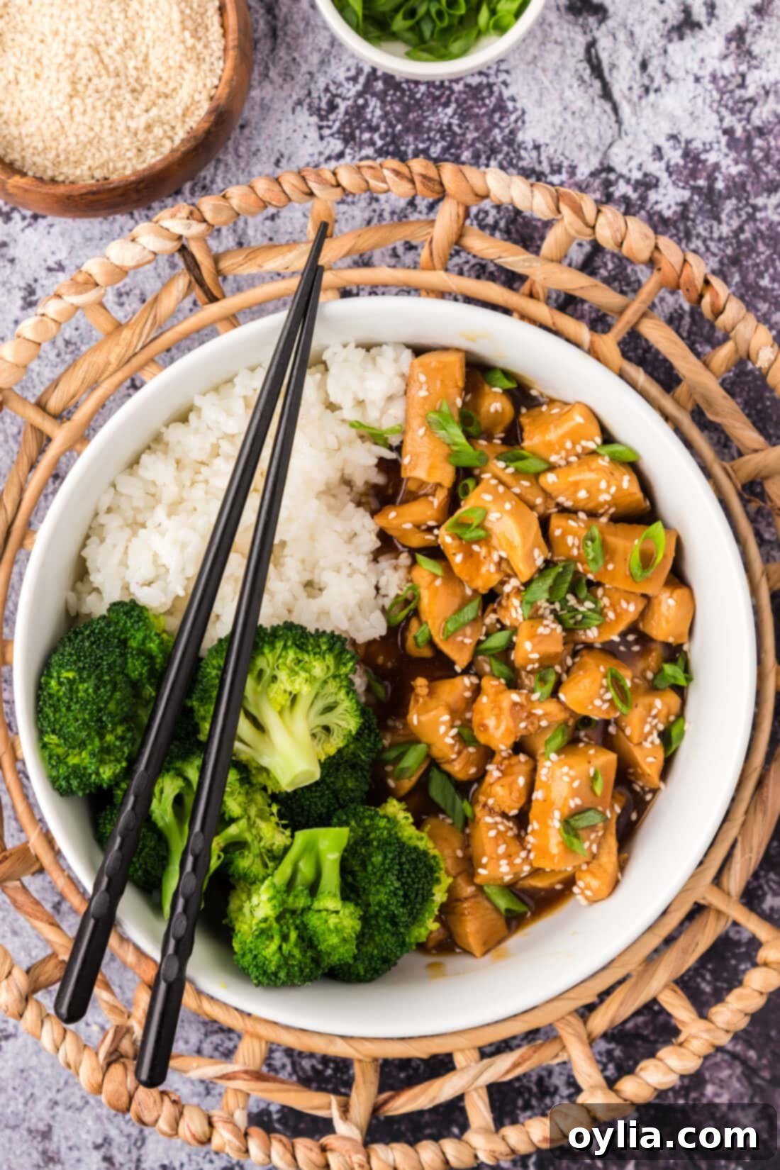 Sticky Teriyaki Chicken 2 Bowl of Teriyaki Chicken with rice and broccoli
