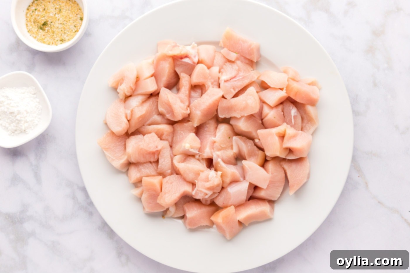 boneless skinless chicken breasts chopped into bite sized pieces ready for cooking