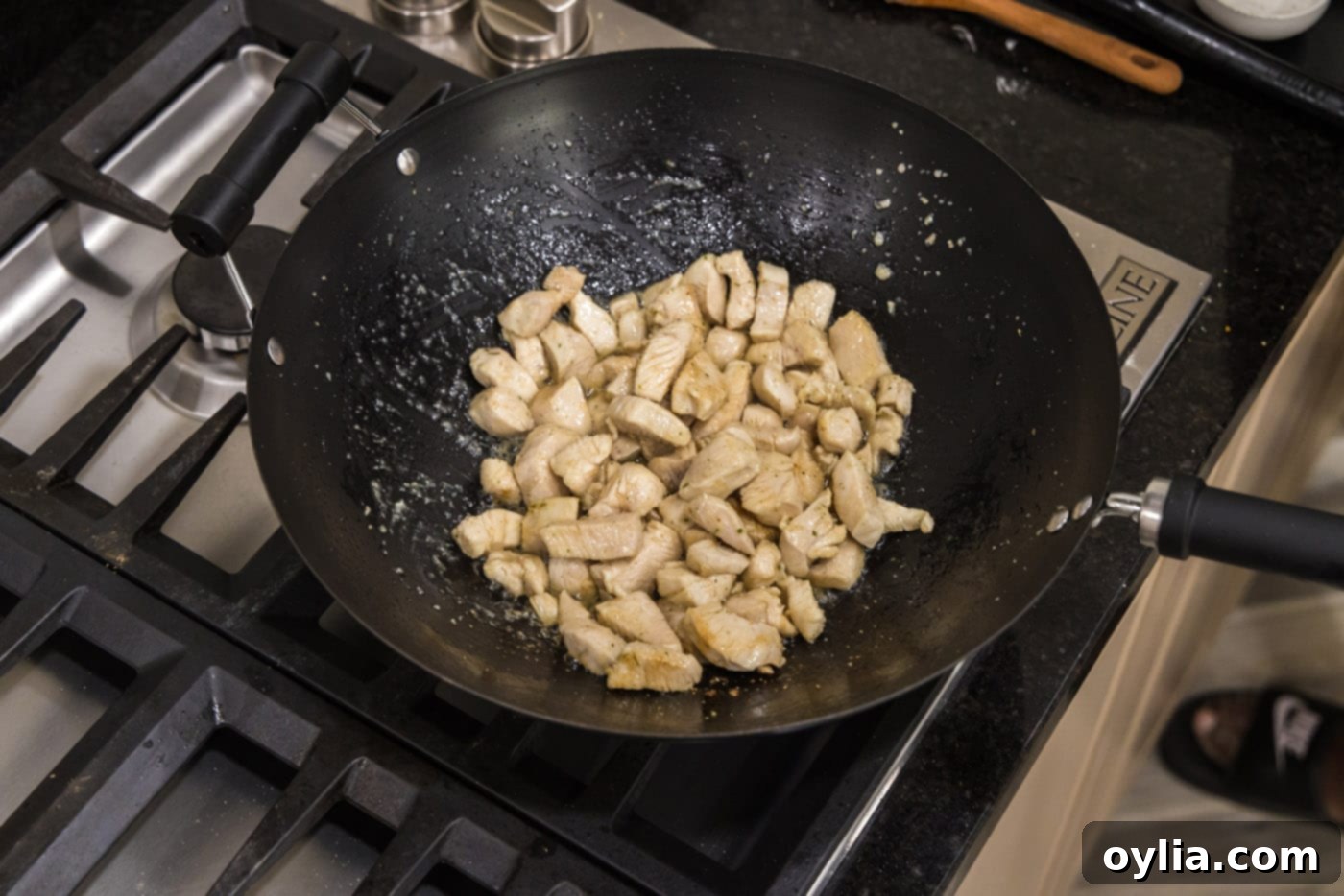 cooked chicken pieces in a skillet, no pink visible