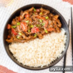 Beijing Beef served with rice in a bowl