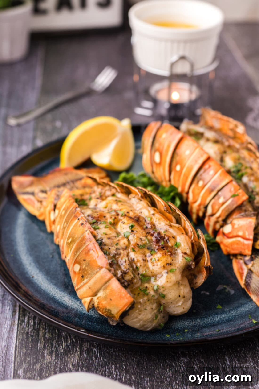 A delectable close-up of a perfectly grilled lobster tail on a plate, garnished with fresh herbs