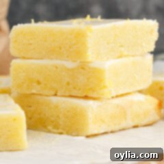 Zesty Lemon Brownies 13 Stack of Lemon Brownies with a vibrant lemon glaze, showcasing their appeal.