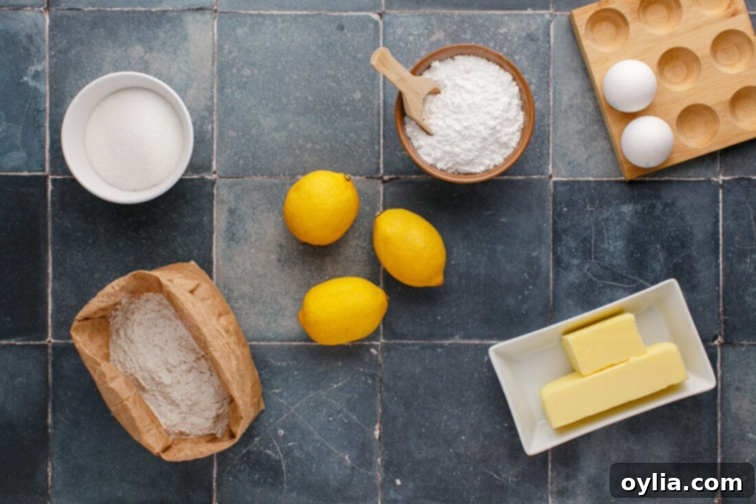 Zesty Lemon Brownies 4 A colorful array of ingredients laid out for making lemon brownies, including fresh lemons, butter, sugar, and flour.