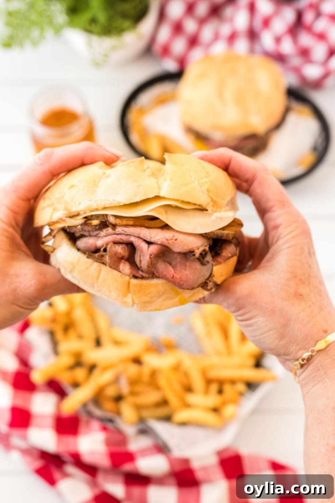 Tender Roast Beef Masterpiece 3 A Roast Beef Sandwich being held by two hands, ready to be eaten