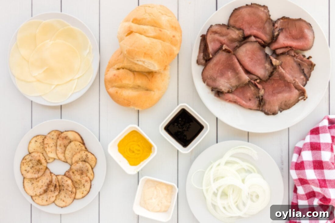 Tender Roast Beef Masterpiece 4 Ingredients for Roast Beef Sandwiches laid out on a wooden board