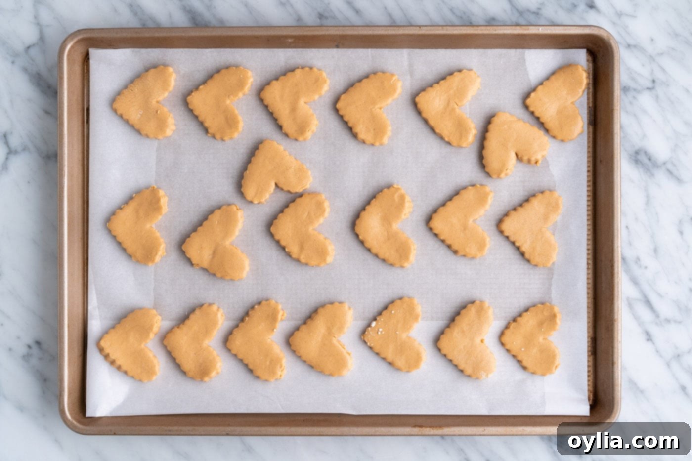heart shaped peanut butter bars on a baking sheet