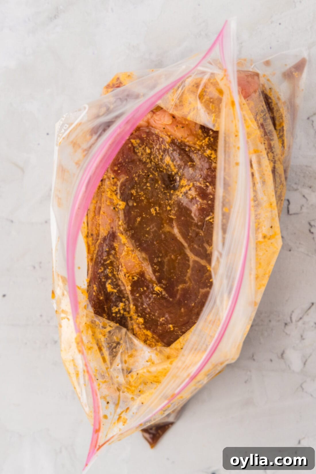 Ribeye Steak Marinade in an open zipper bag, showing the marinating steak