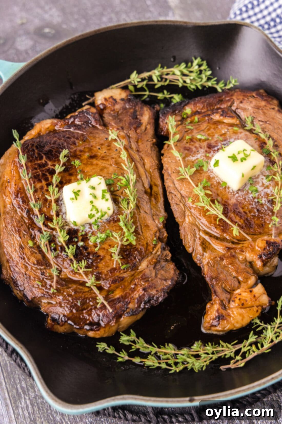 Two Cast Iron Ribeyes in a cast iron pan