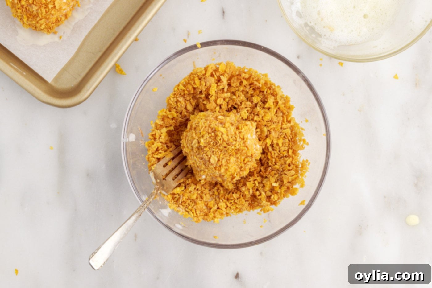 coating ice cream ball in cornflake mixture