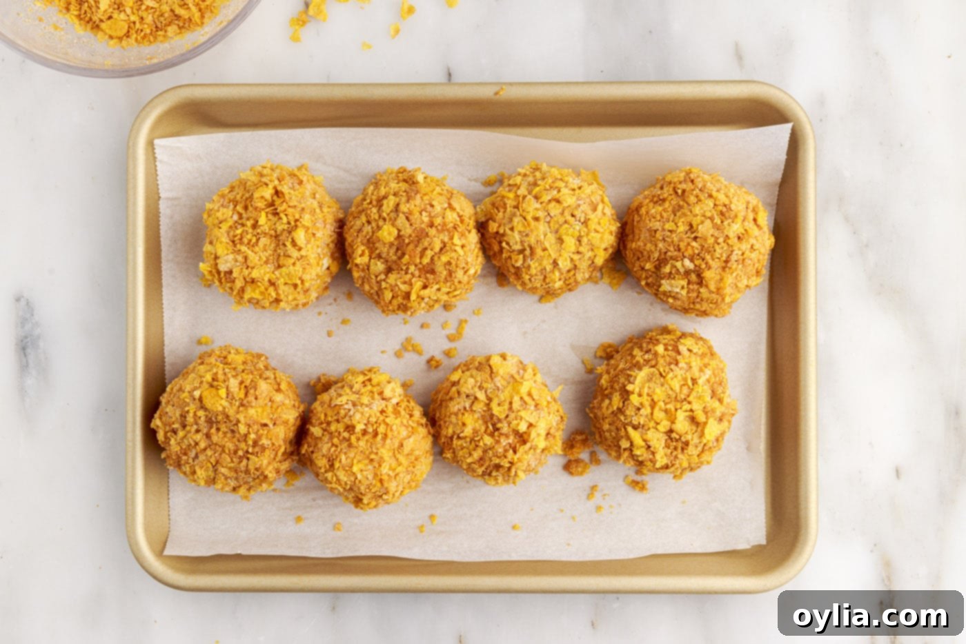 fried ice cream balls on a baking sheet