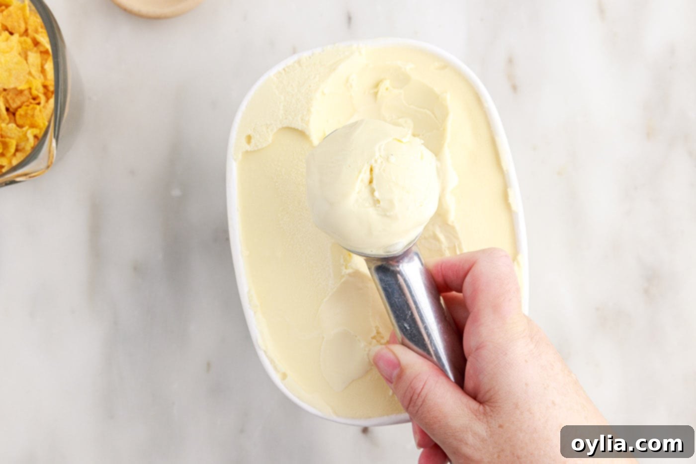 hand rolling ice cream with a scoop