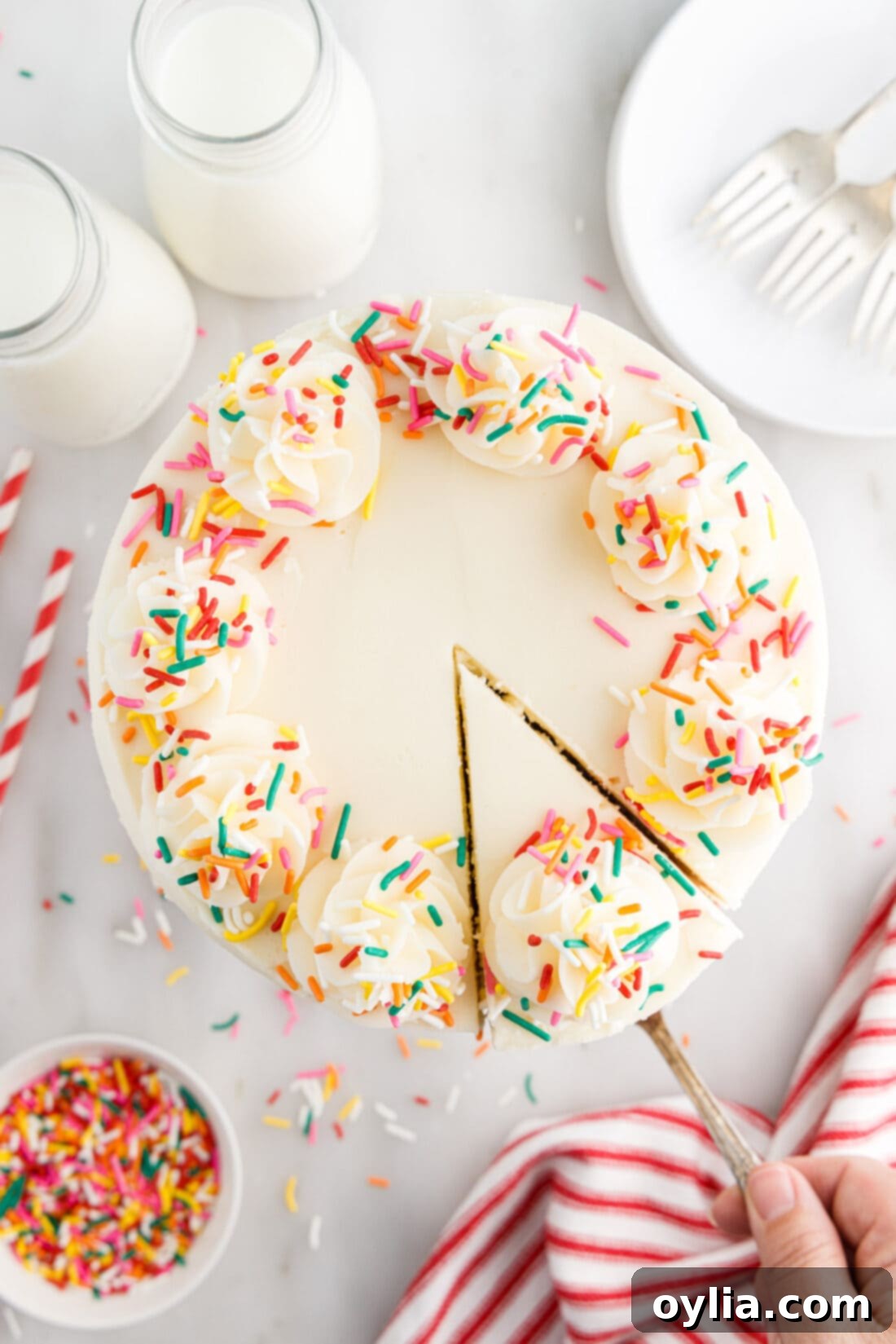 Confetti Celebration Cake 2 Overhead photo of Funfetti Cake with a slice being removed