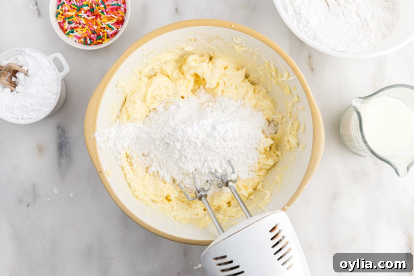 mixing flour mixture into butter mixture
