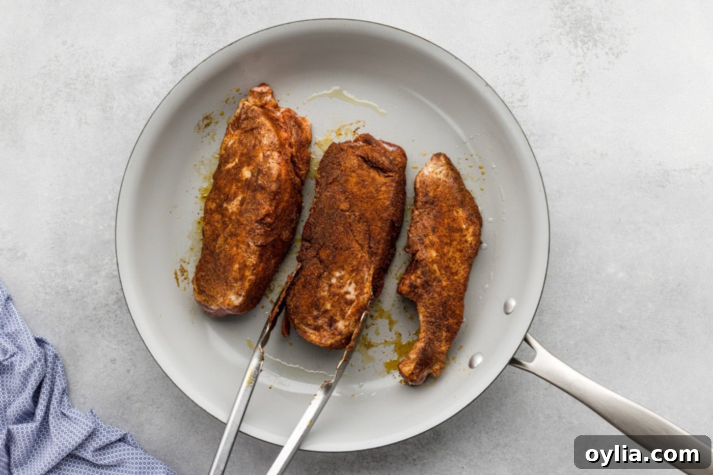 searing country style ribs in a skillet