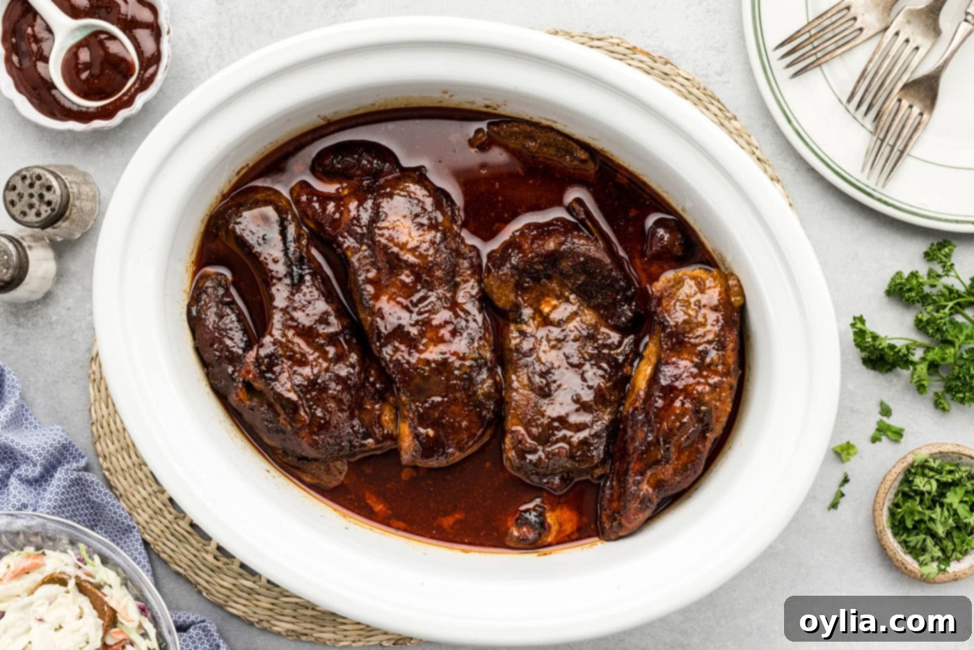 slow cooker country style ribs with barbecue sauce in a crock