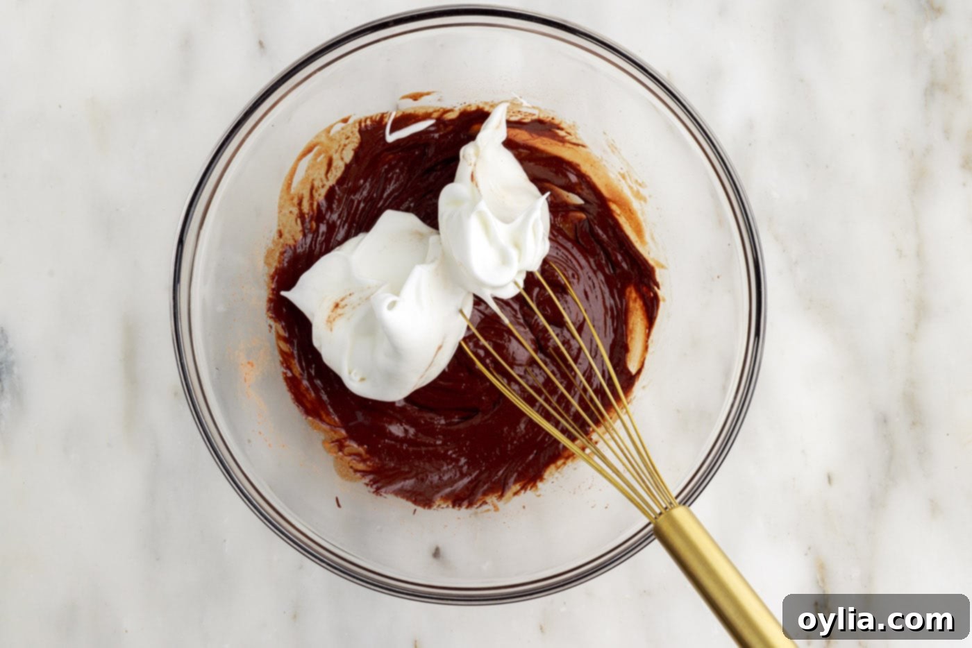 Molten Chocolate Delight 13 combining whipped egg whites and chocolate batter with a whisk, half at a time