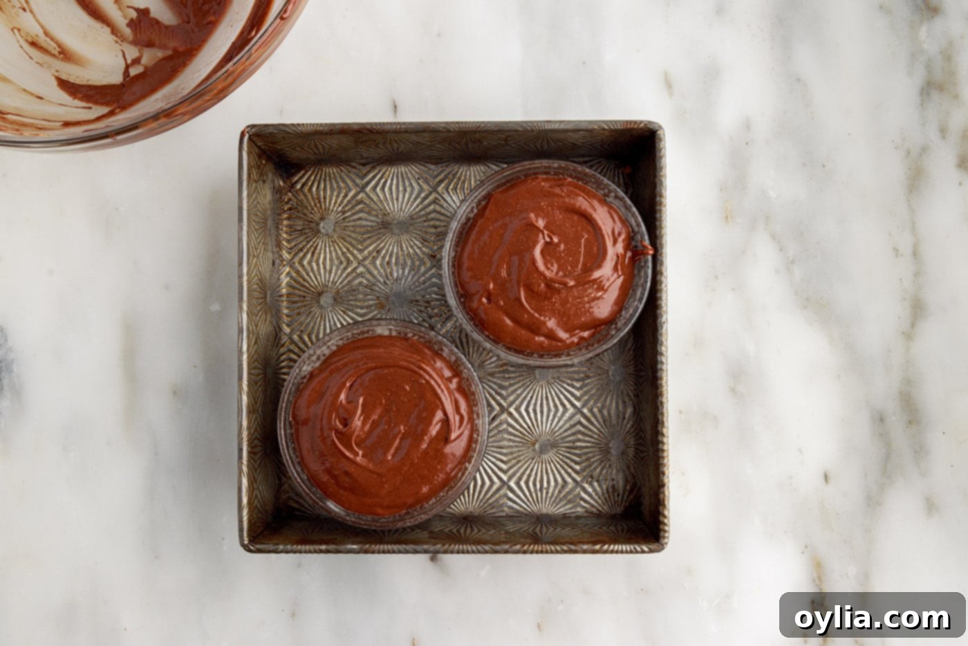 Molten Chocolate Delight 15 lava cake batter being poured into ramekins