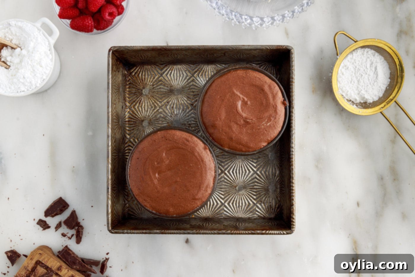 Molten Chocolate Delight 16 baked lava cakes on a baking sheet, fresh out of the oven