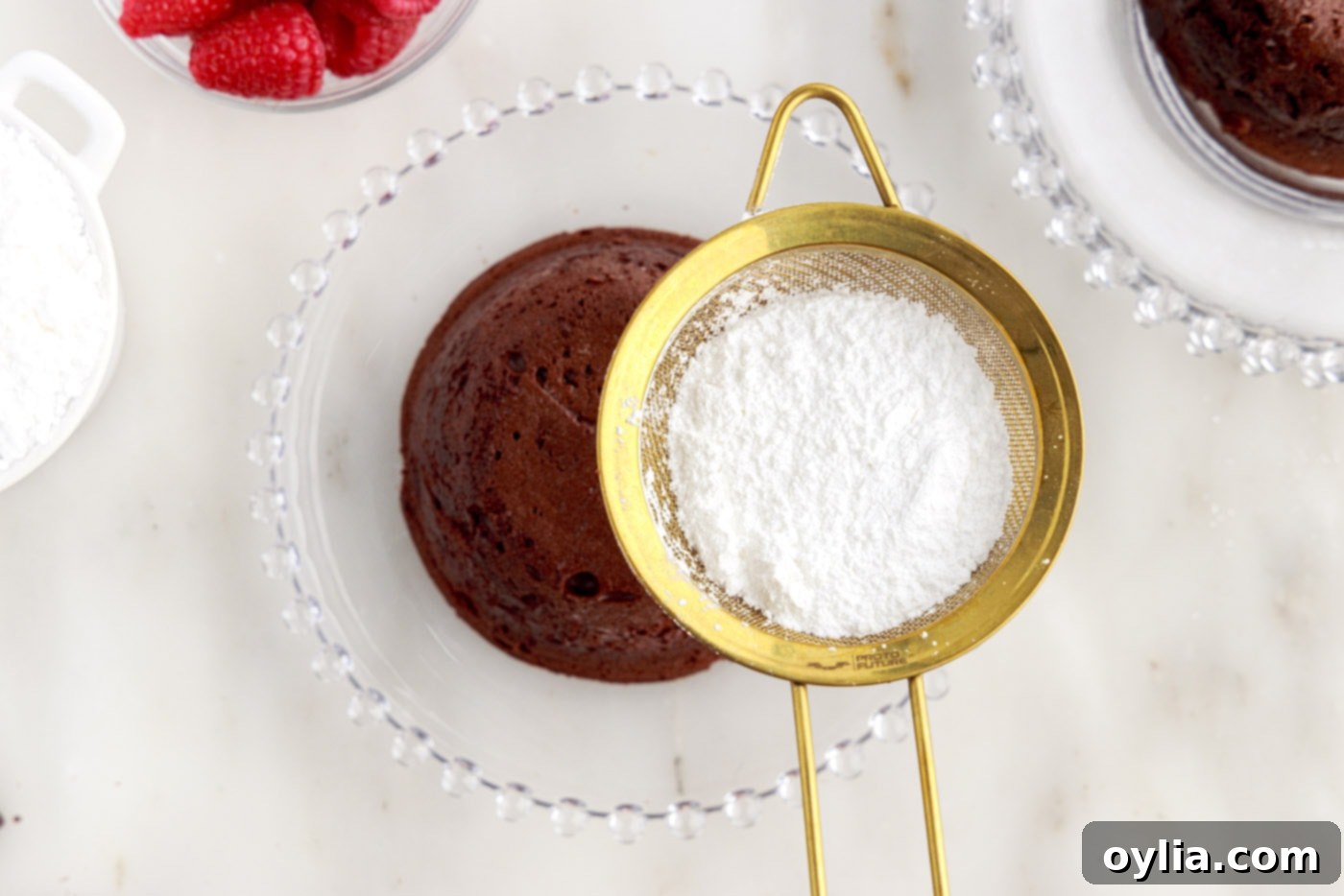 Molten Chocolate Delight 18 dusting lava cake with powdered sugar as a final garnish