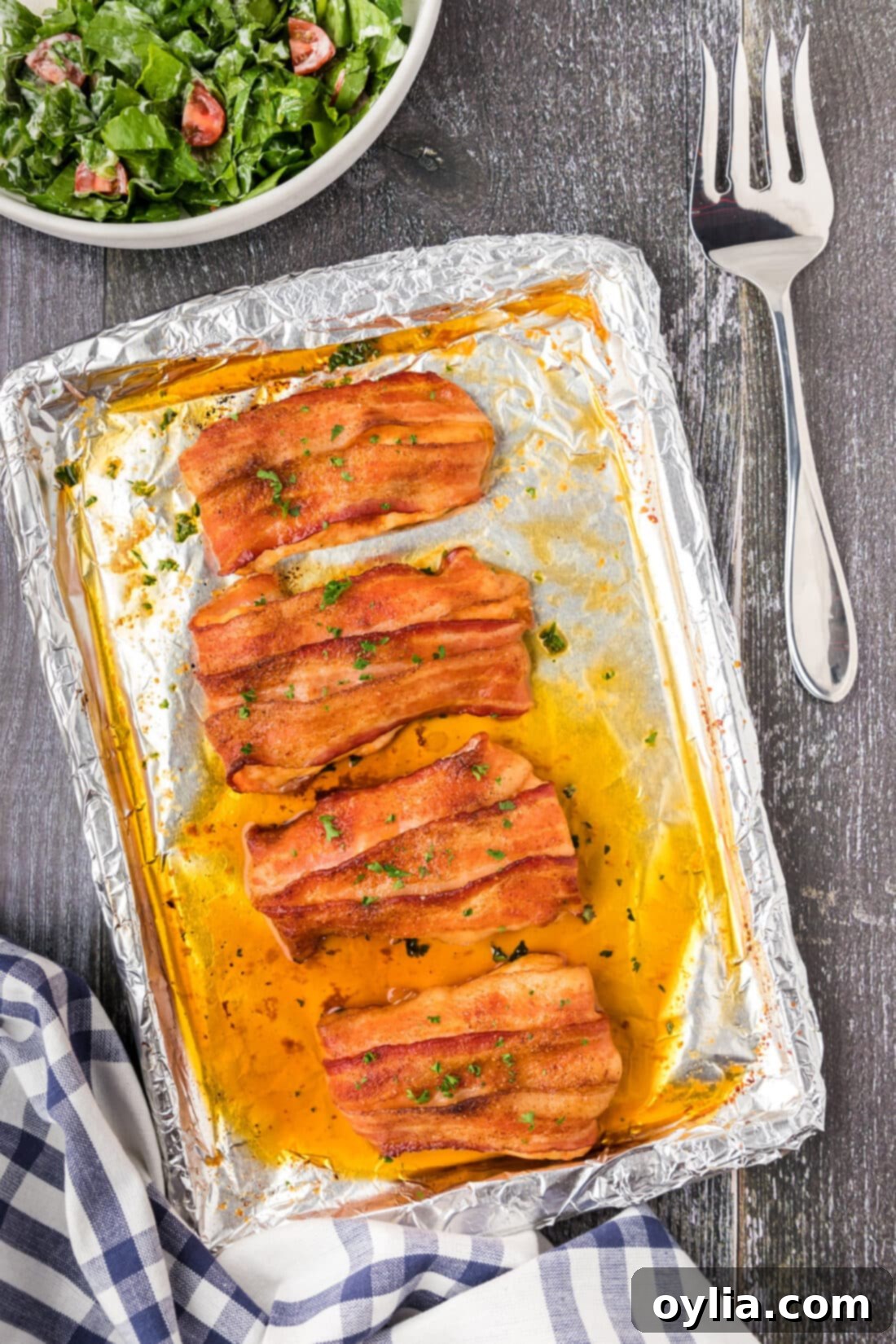 Pan of Crispy Baked Bacon Wrapped Chicken Breasts, golden brown and ready to serve