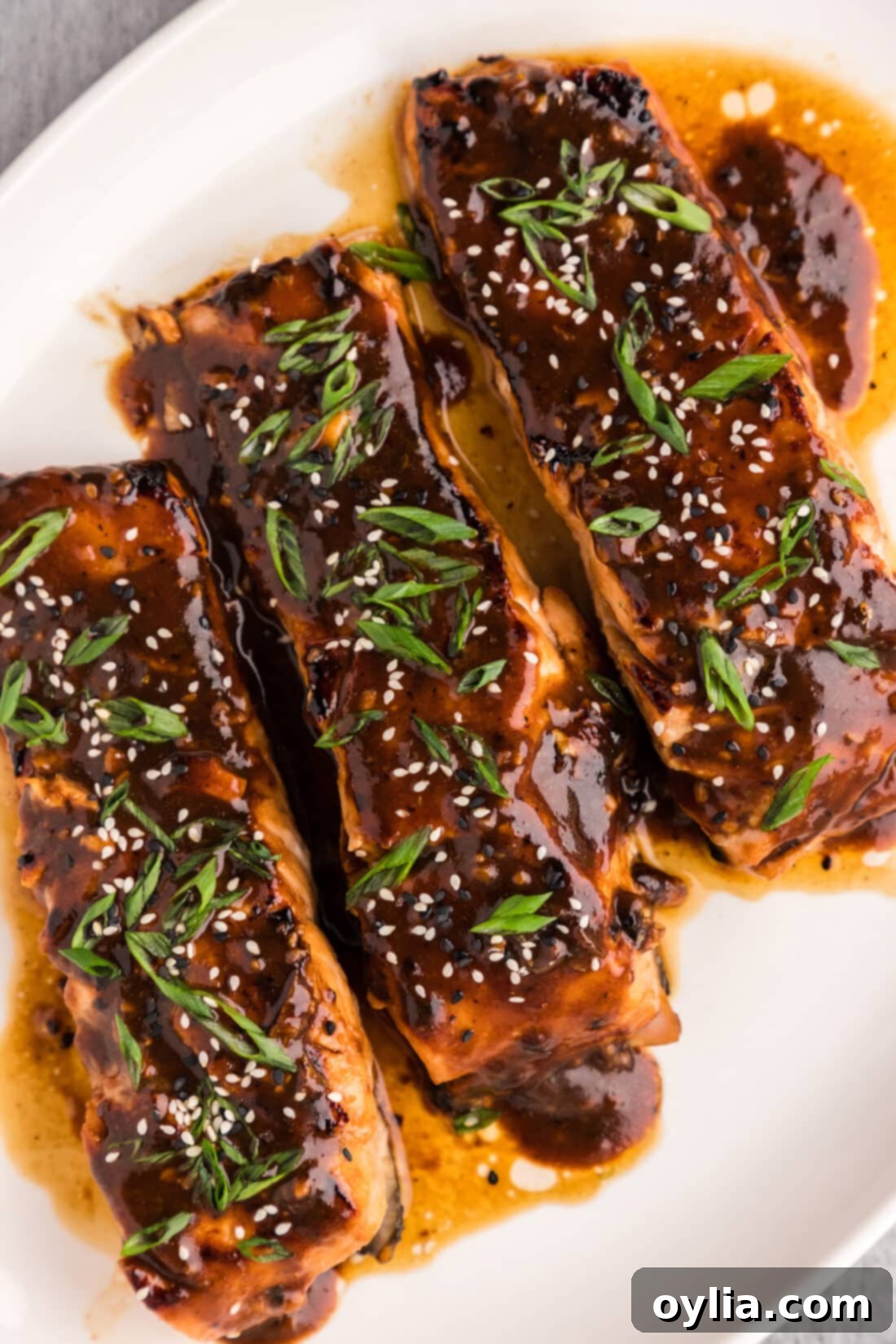 Glazed Teriyaki Salmon 3 Platter of Pan-Seared Teriyaki Salmon garnished with sesame seeds