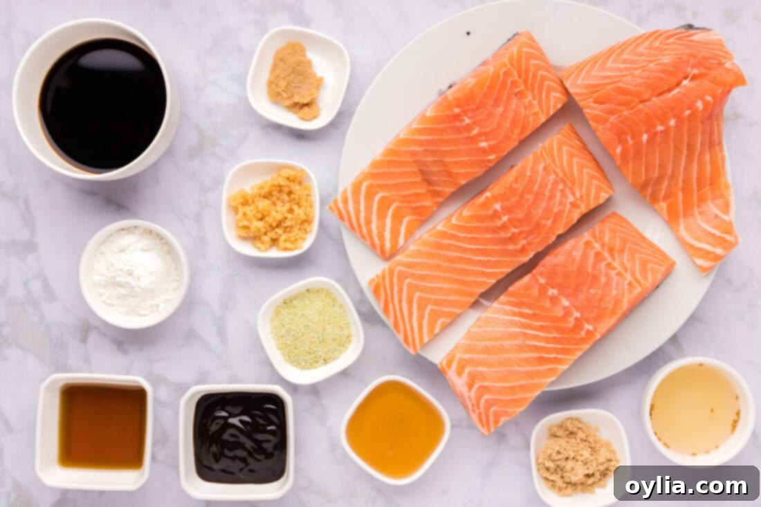 Glazed Teriyaki Salmon 4 Ingredients for Teriyaki Salmon laid out on a wooden board