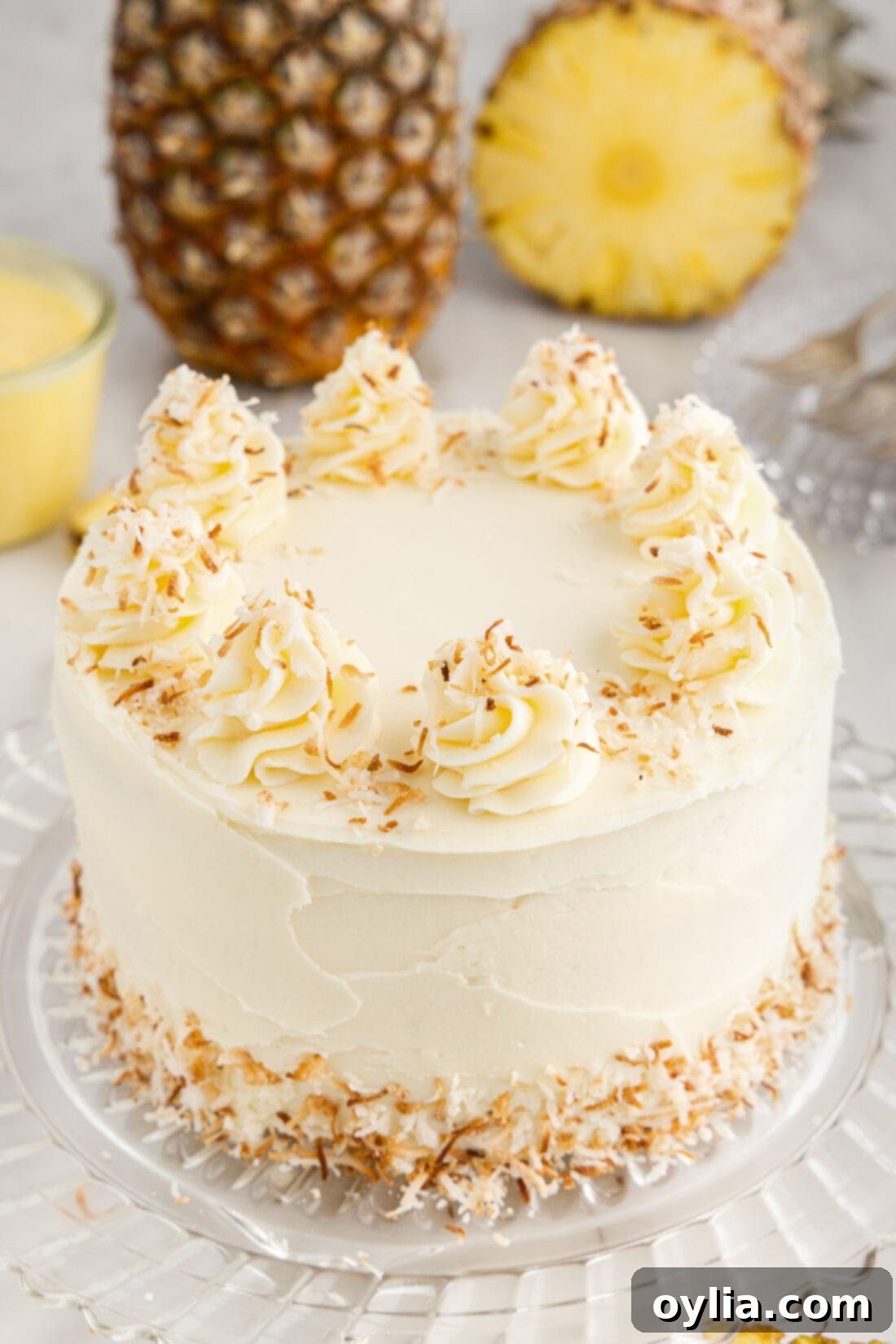 Pineapple Coconut Cake on a cake stand