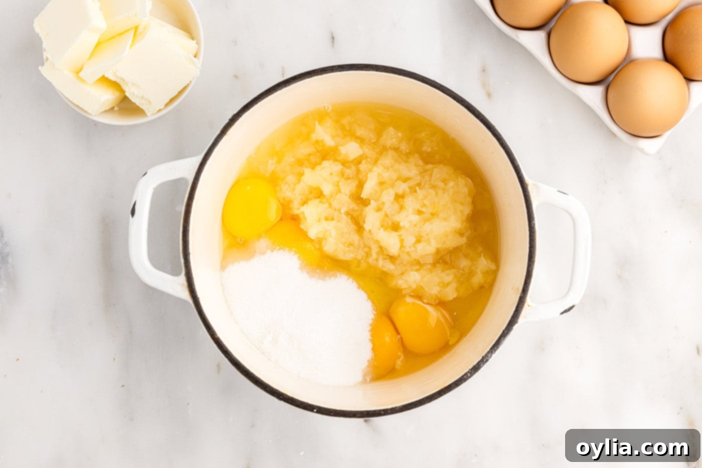 ingredients for pineapple curd in a sauce pan