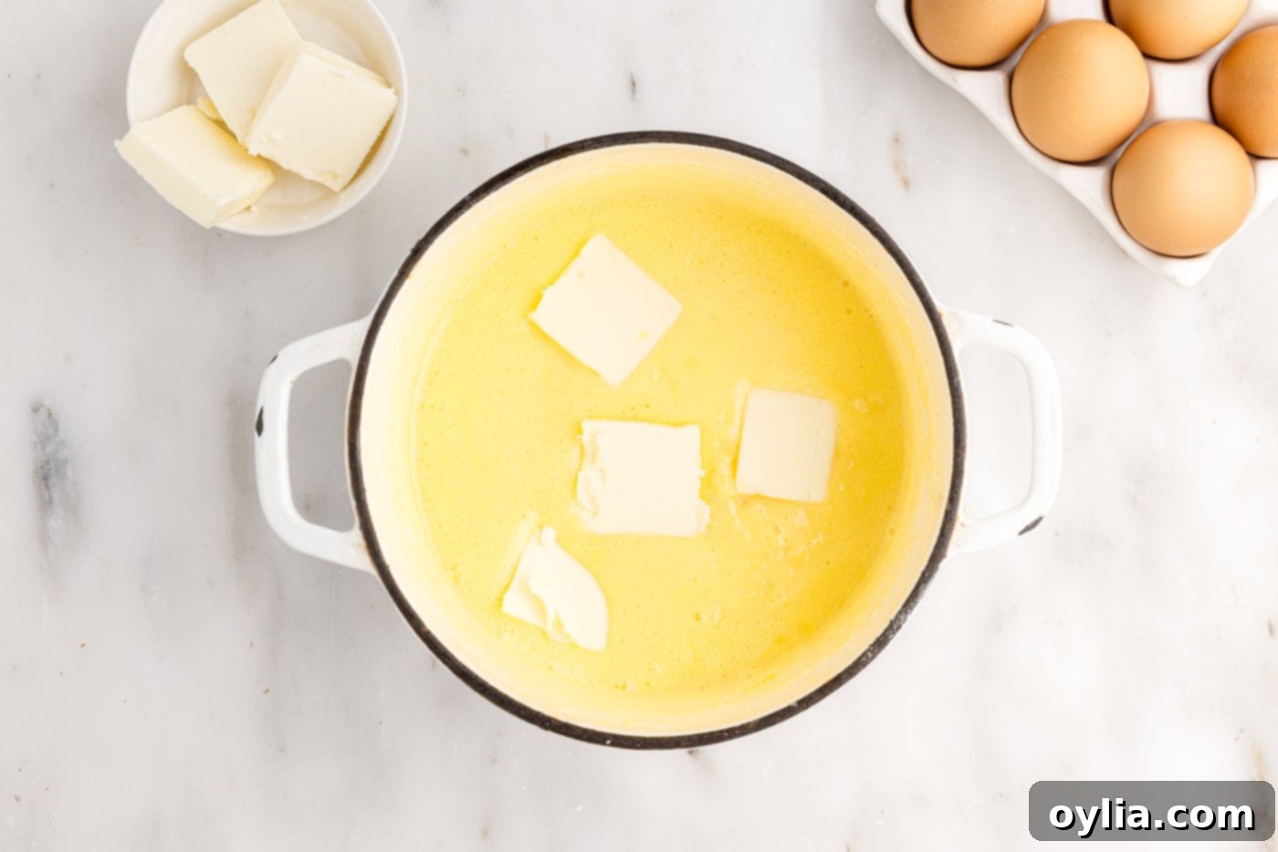 adding butter to pineapple curd