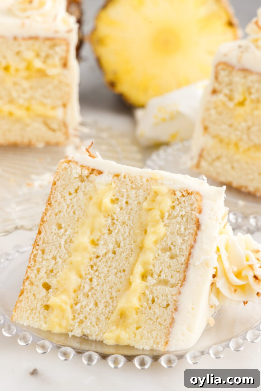 Slice of Pineapple Coconut Cake on a plate
