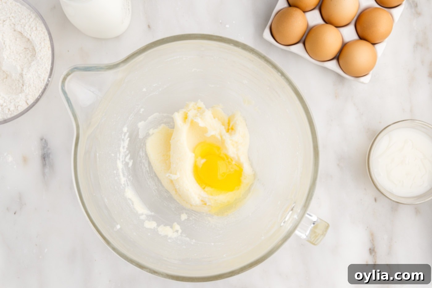 adding egg to butter and sugar mixture