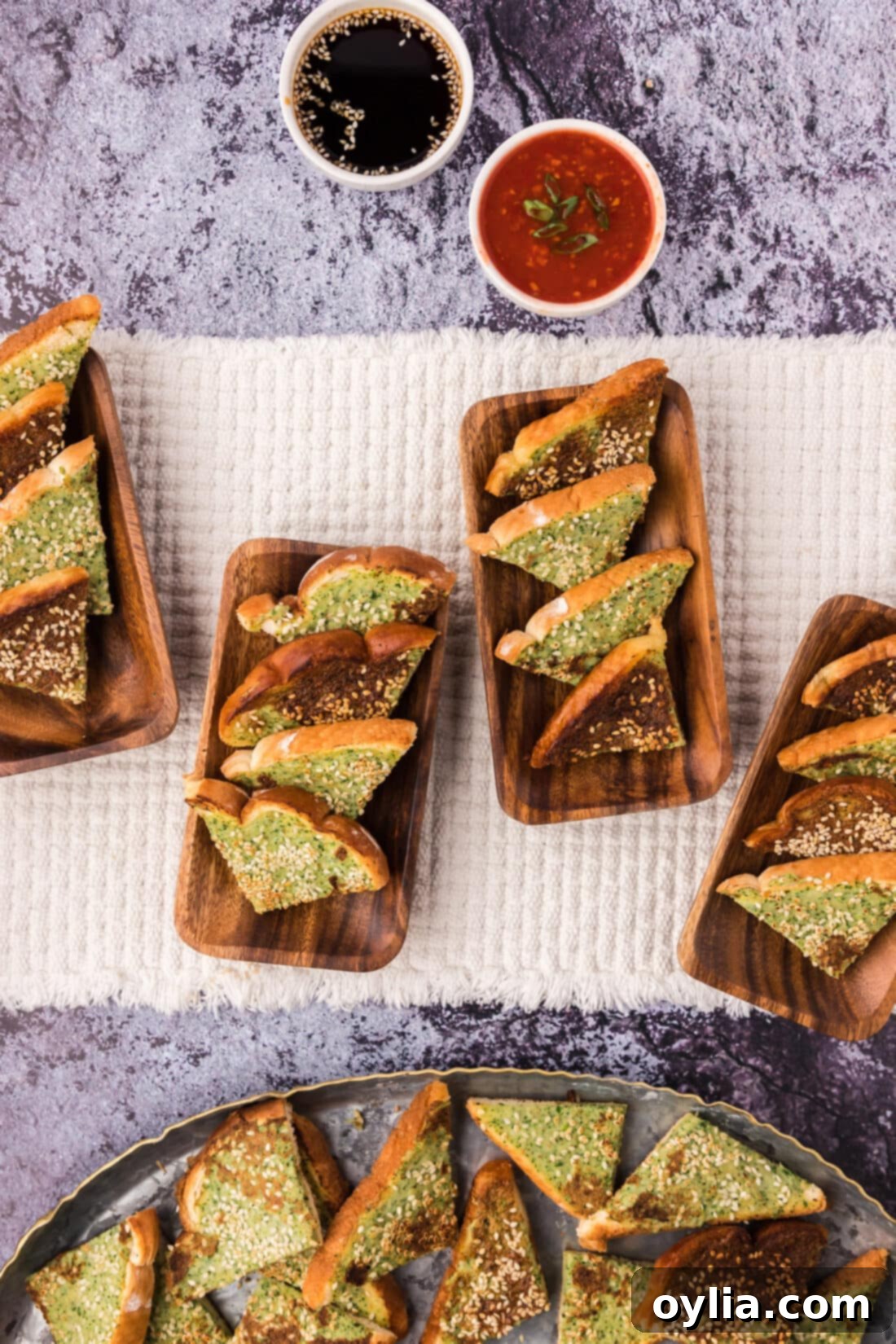 Irresistible Crispy Shrimp Toast 12 Shrimp Toast served on wooden serving plates with dipping sauces on the side