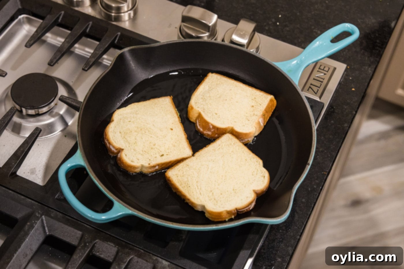 frying shrimp toast in a skillet