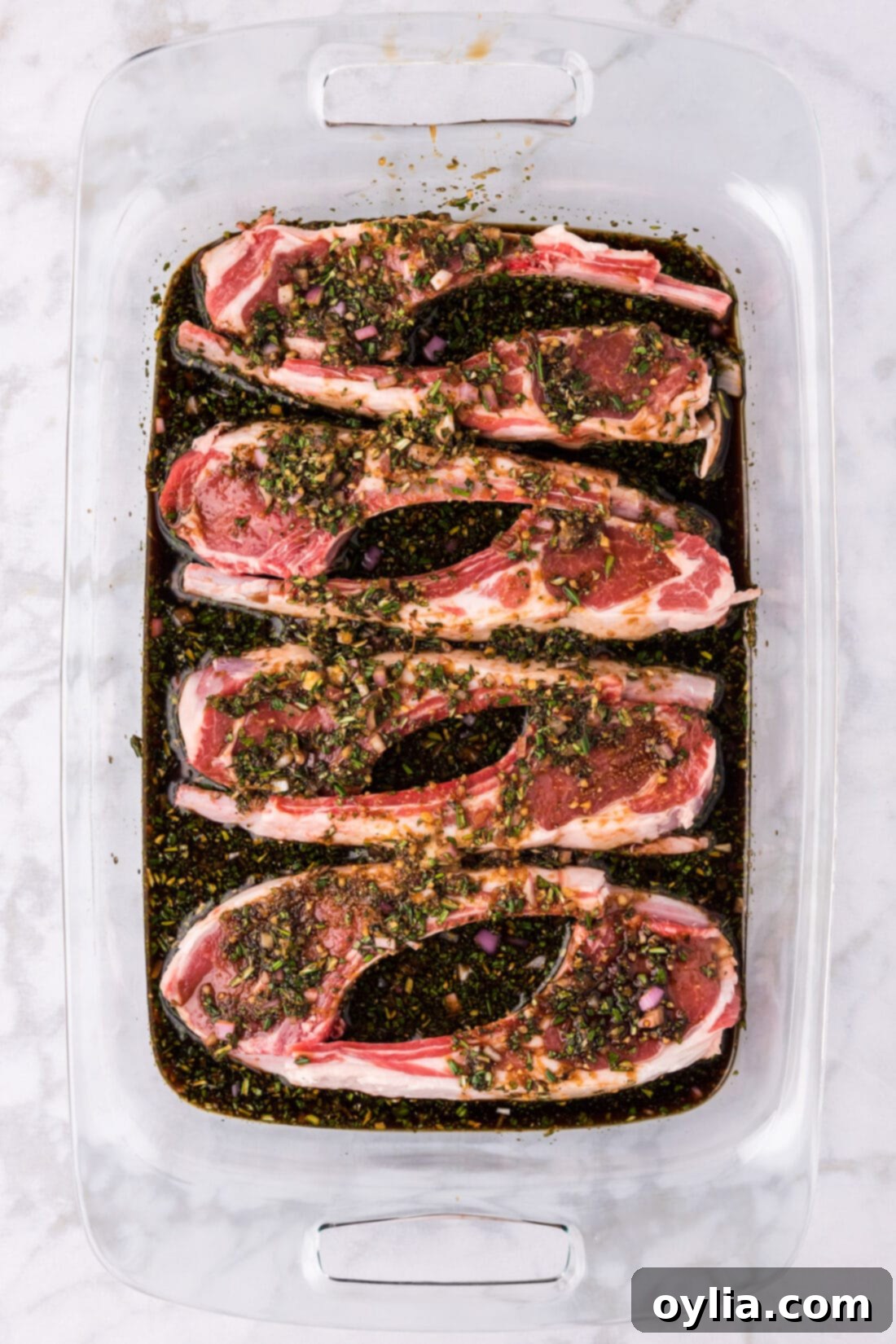Lamb Chops and Lamb Chop Marinade sitting in a 13 x 9 pan