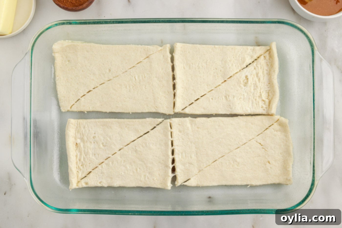 crescent roll dough on the bottom of a baking dish